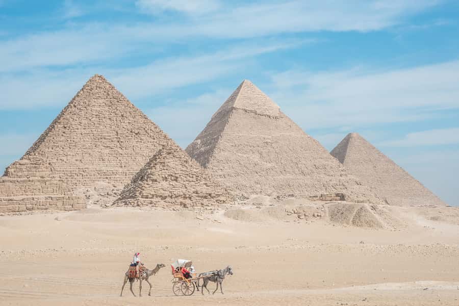 Cairo: Half Day Pyramids Tour by Camel or Horse Carriage - The Sphinx adds a different kind of mystery