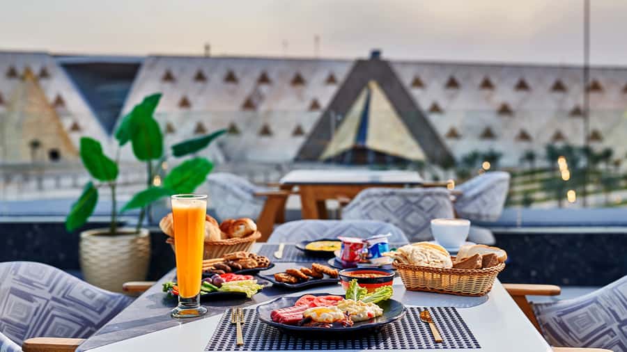 Cairo: Sunrise Camel Ride, Pyramids Tour & Local Breakfast. - One hour on camelback with the pyramids ahead