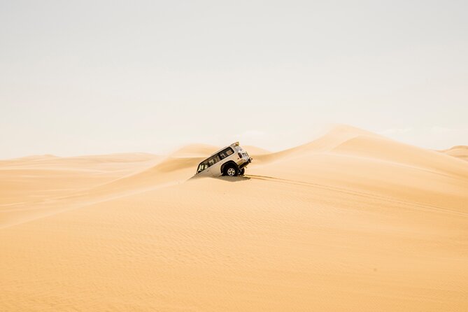 From Cairo: Desert Safari, Waterfalls, Sand boarding and Camel ride with Lunch - Wadi El Rayan Waterfalls and Desert Lakes