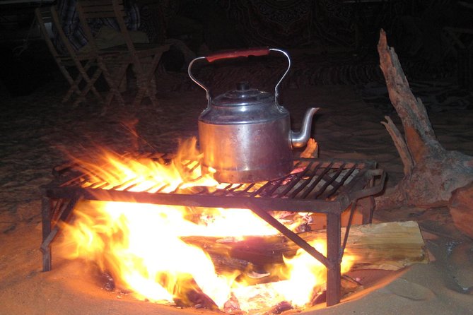 Overnight White Desert Safari Camping from Cairo - Dinner, firelight, and a cold night in camp