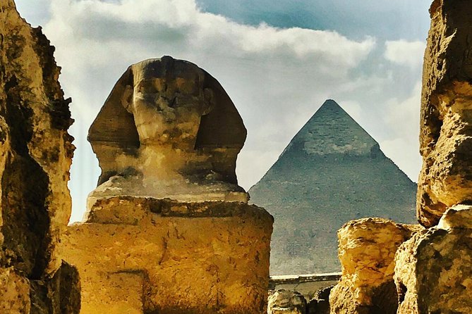 Private Tour to Giza Pyramids Sphinx with Camel Riding - Riding a camel beside the pyramids
