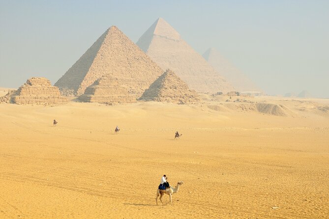 Private Tour To Pyramids of Giza Memphis Saqqara With Lunch - The camel ride behind the pyramids