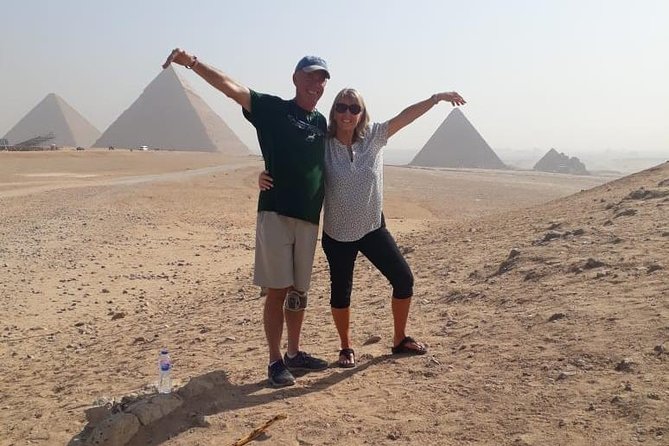 Top rated Giza Pyramids and Sphinx Tour from Cairo Airport - The camel ride and views over Cairo
